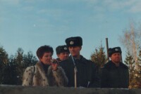На трибуне.